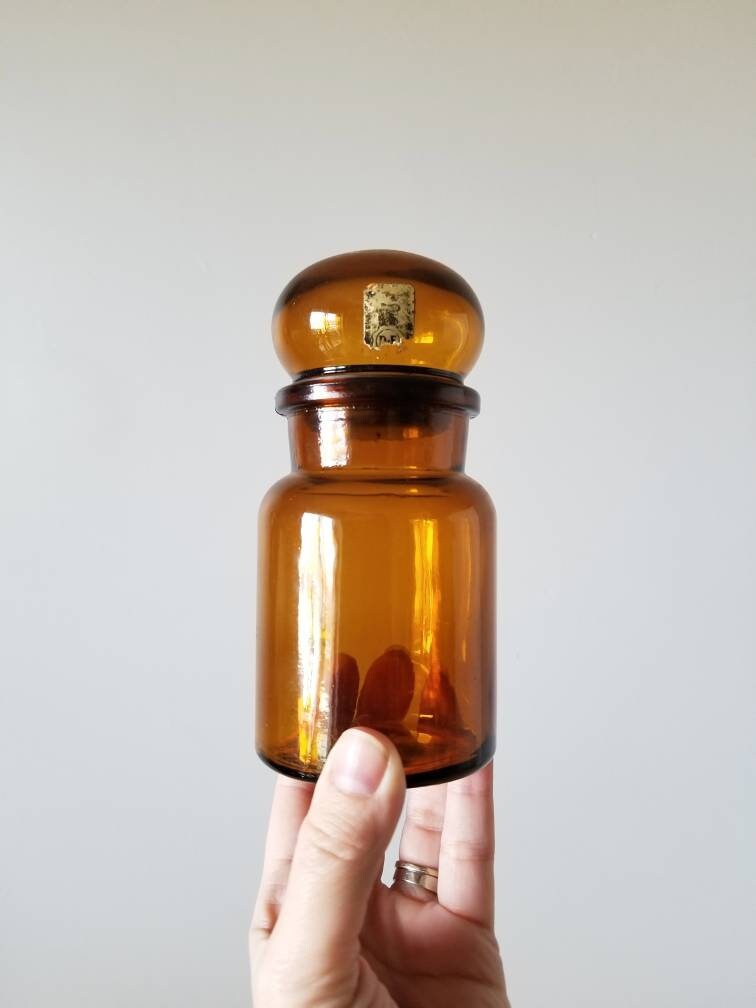 Vintage amber apothecary jar with bubble lid kitchen storage