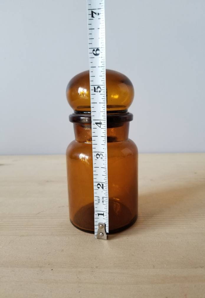 Vintage amber apothecary jar with bubble lid kitchen storage