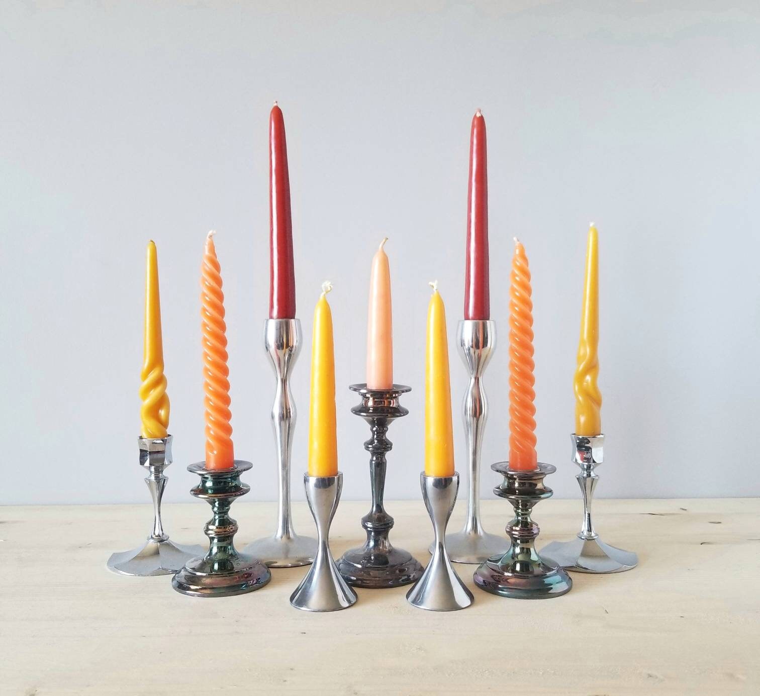 Vintage curated mixed candle holder set of nine E. P. Lead, chrome