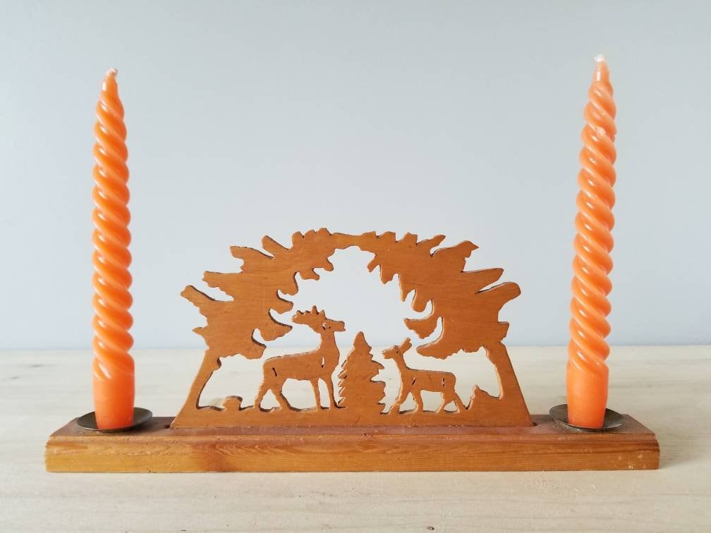 Vintage Erzgebirge style candle holder with deer and tree cut outs