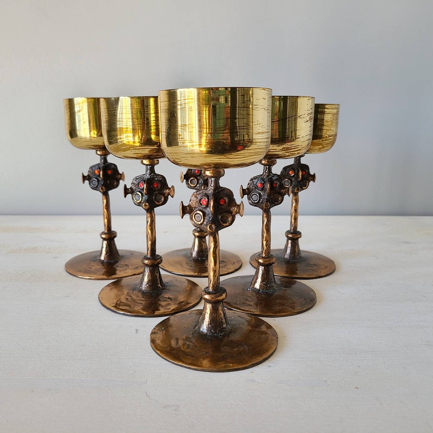 Vintage brass brutalist wine goblets with abstract faces mid century stemware