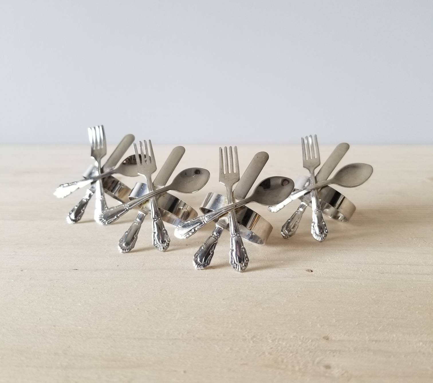 Vintage silver plate fork knife and spoon napkin rings