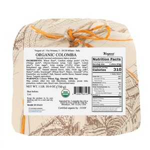 Op de afbeelding: Een biologische Colomba-cake, een natuurlijk gezuurd banketbakkerijproduct, verpakt in papier en vastgebonden met oranje touw. Het etiket toont ingredi&euml;nten, voedingsfeiten en het USDA Organic-zegel. Nettogewicht: 750 g.