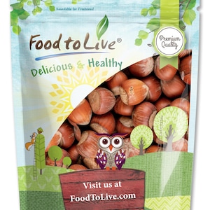May include: A package of Food to Live hazelnuts. The bag features a cartoon owl, trees, and the text "Delicious & Healthy." The bag also has the text "Visit us at FoodToLive.com" on a wooden sign.