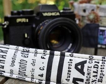 Camera strap, newspaper for DSLR or system camera