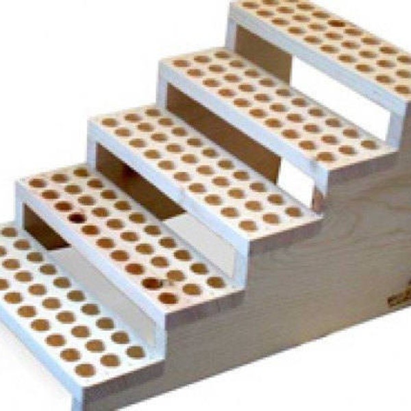 May include: A white wooden tiered stand with five levels, each level has a grid of round holes. The stand is designed to hold and display items like essential oils or small bottles.