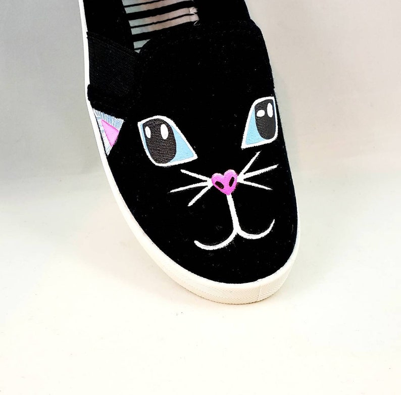 shoes with cat faces on them