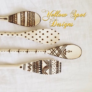 Decorative wood burned cooking spoons.