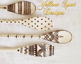 Decorative wood burned cooking spoons.