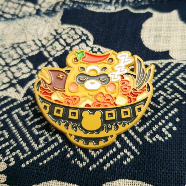 Guoba slaapt in emailpin gekookte visstoofpot van restaurant Wanmin Xiangling Genshin Impact