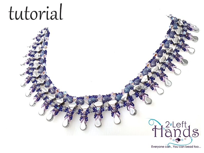 May include: A beaded necklace with a silver and purple color scheme. The necklace features a cascading design with teardrop-shaped beads. The necklace is labeled "2 Left Hands" and "Everyone can, You can bead too..."