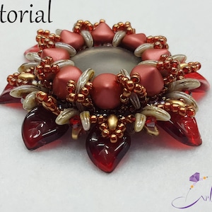 May include: A red, gold, and white beaded flower brooch with a gray center. The brooch is made with seed beads and has a starburst design.