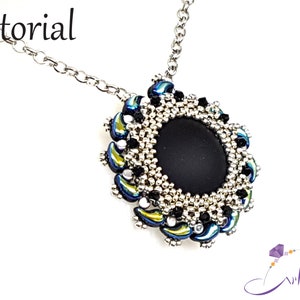 May include: A silver chain necklace with a black and silver beaded pendant. The pendant features a round black stone surrounded by silver and iridescent blue beads.