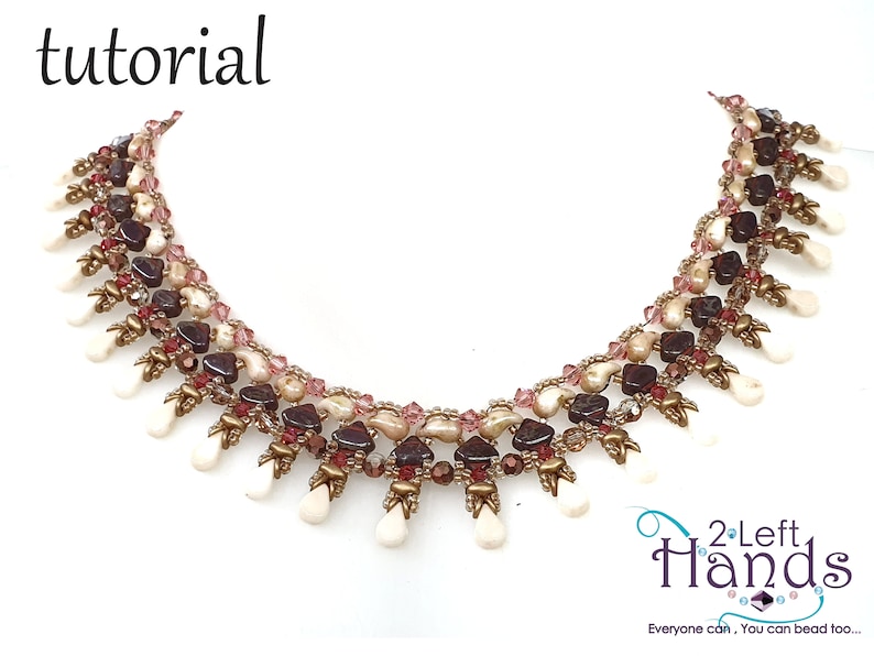 May include: A multi-strand beaded necklace with a cascading fringe of white teardrop beads. The necklace is made with brown, pink, and white beads, and gold accents. The necklace is labeled "2 Left Hands" with the tagline "Everyone can, You can bead too..."