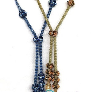 May include: Two beaded necklaces, one blue and one gold, with decorative flower-shaped beads and crystal accents. The necklaces are tied together at the bottom with a knot.