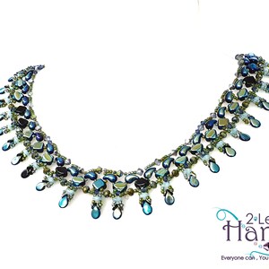 May include: A multi-strand necklace with teardrop-shaped beads in shades of blue, green, and black. The necklace is made with iridescent glass beads and has a cascading design.