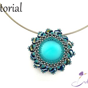 May include: A turquoise pendant necklace with a beaded design featuring silver and blue beads. The pendant is a circle with a turquoise center and a silver and blue beaded border.