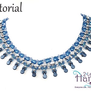 May include: A blue and silver beaded necklace with a teardrop design. The necklace is made with small beads and has a delicate, feminine look. The necklace is called "2 Left Hands" and the text "Everyone can, You can bead too..." is below the necklace.