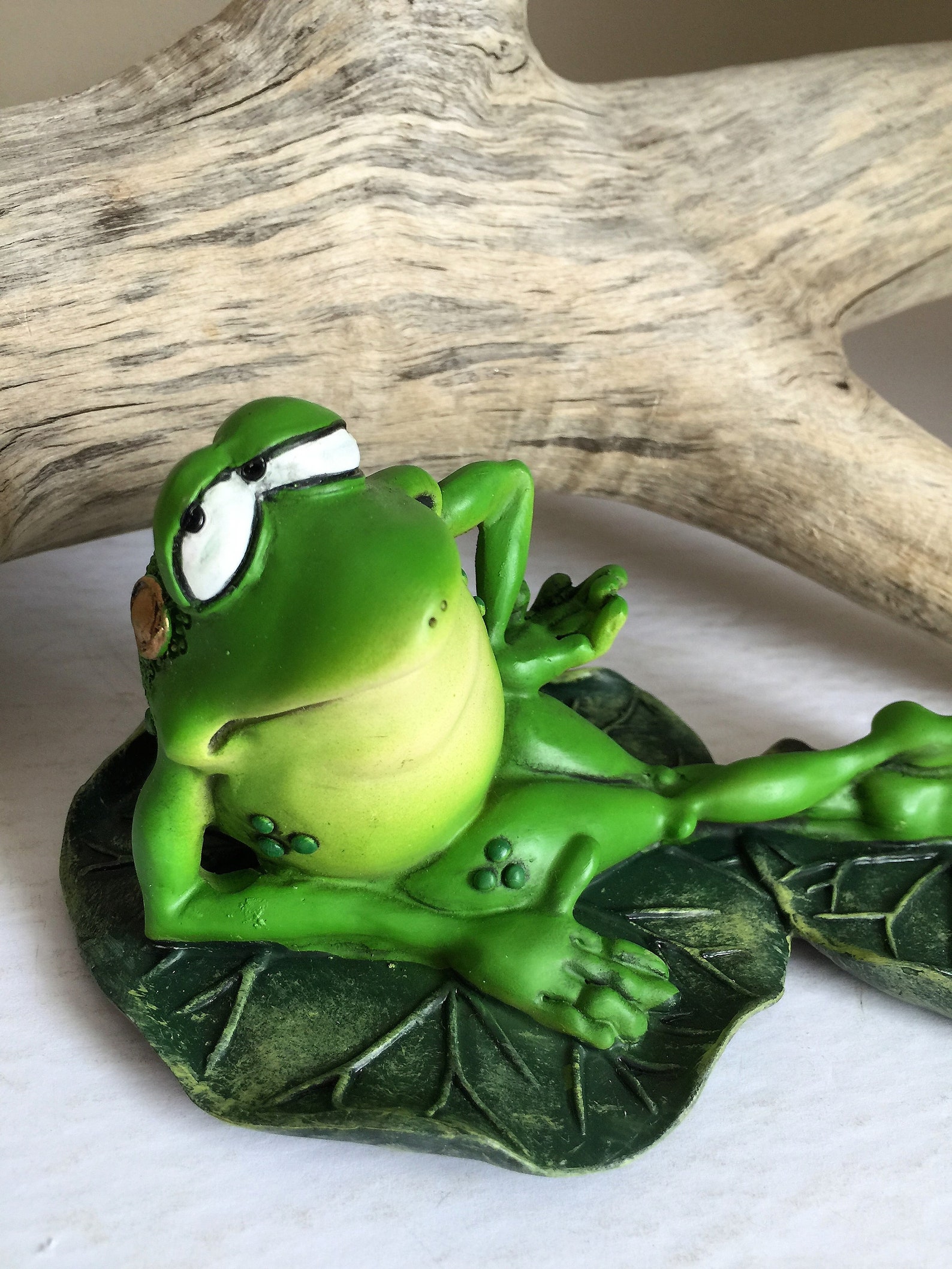 lounging frog statue