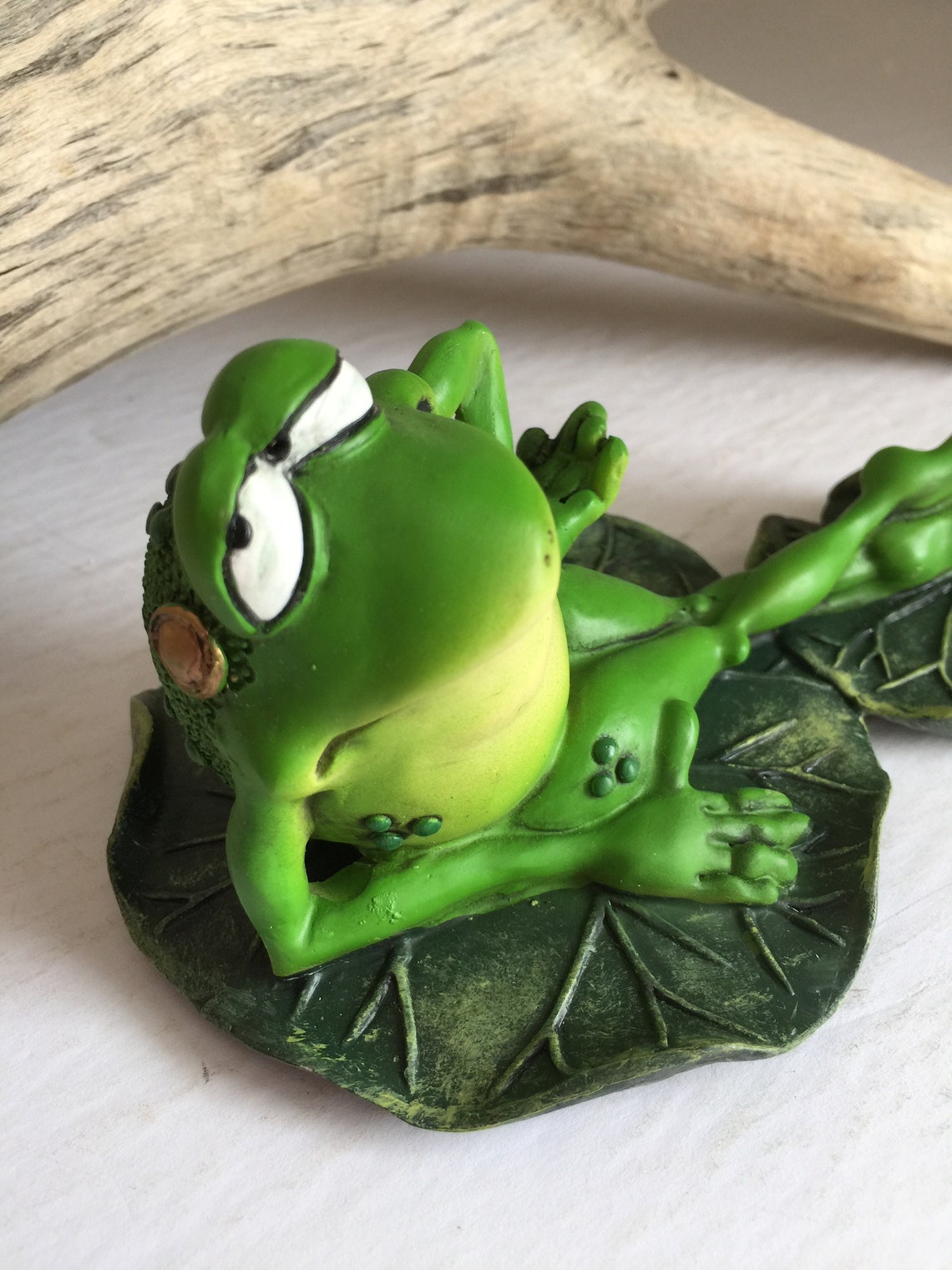 lounging frog statue