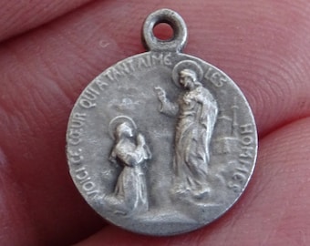 Religious silver plated catholic medal pendant charm medallion of Holy Jesus Christ and a kneeling woman.  ( M 14)