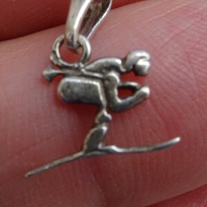 Vintage French silver ( MARKED ) vermeil medal pendant charm medallion of a downhill skier. ( S 14 )