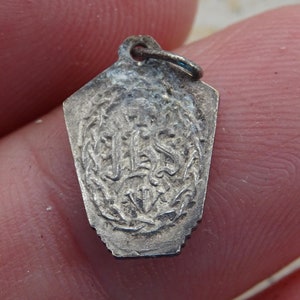 Religious antique French catholic silvered medal pendant charm medallion of Saint Infant Jesus of Prague and IHS.  ( 5 )