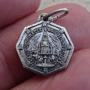 Religious antique silver plated catholic medal pendant Holy charm medallion of Bois Seigneur Isaac a pilgrimage town in Belgium. ( 5 d )