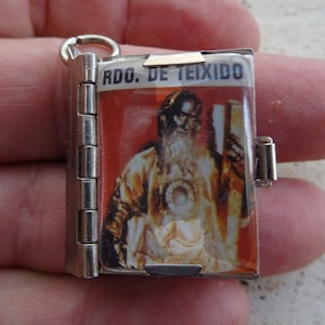 Religious Spanish silver plated booklet locket relic shrine souvenir of San Andrés Andreas de Teixido.  ( 1 )