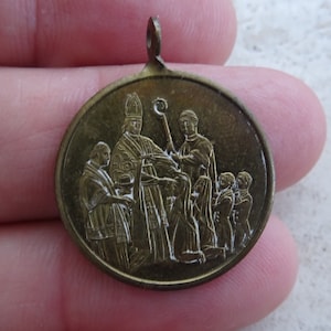Antique religious German silver plated medal pendant Holy charm medallion of a bishop giving children the Holy Confirmation. ( M 29 )