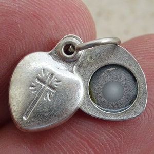 Religious silver plated slider locket pendant charm medallion pendant medal of Agnus Dei the lamb. ( 25 )
