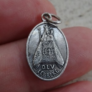 Religious silvered medal pendant medaillon charm medallion of Holy Virgin Mary souvenir of Lebbeke a pilgrimage town in Belgium. O 1