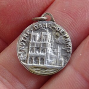 Religious antique silvered catholic medal pendant charm medallion of Holy Virgin Mary of the cathedral Notre Dame of Paris. (  2a )