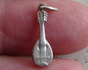 Vintage French silver ( MARKED ) pendant medal charm medallion of a guitar. ( T 11  )