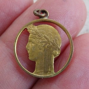 Antique bronzed medal pendant medal charm medallion with a woman carved from a coin 50 centimes 1939. ( G 12 )