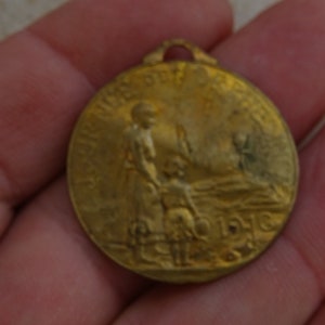 Antique French Art Nouveau copper medal pendant charm medallion of mother with child. ( 13 B )