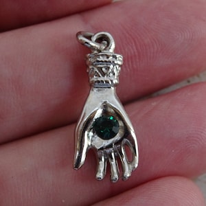 Religious French silvered medal charm medallion pendant of a hand with a green stone. ( 4 )