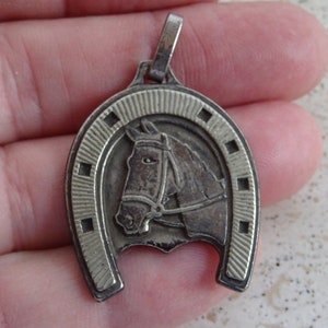 French silvered medal pendant charm medallion of a horse shoe with horse.  ( 15)