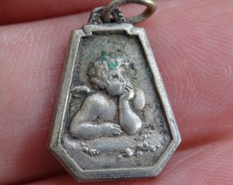 Religious antique silver ( MARKED ) catholic medal medallion charm pendant of a guardian angel cherub Raphael. (  B 19 )