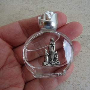 Religious French catholic bottle with siver plated element of Holy Virgin Mary with inside original Holy blessed water of Lourdes. 1