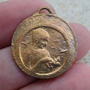 Antique copper French medallion pendant medal charm of woman feeding birds. ( W 11 )