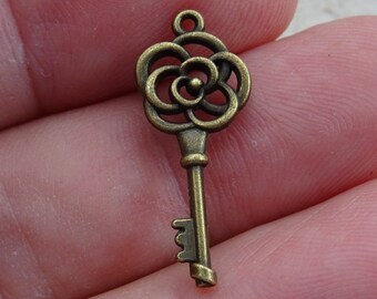 French Bronze Key Charm Pendant Brass Skeleton Key to open a heart. ( C 21 )