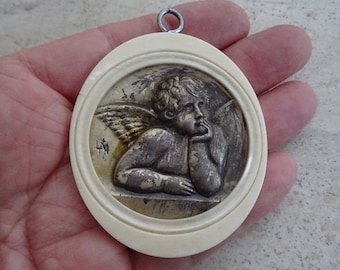 Religious antique French catholic silvered Art Deco medal charm medallion pendant of a cherub Guardian Angel Raphael. ( 8 )