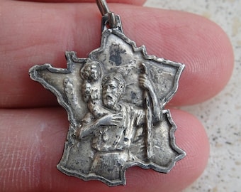 Medalla religiosa plateada, colgante, medallón, amuleto de San Cristóbal, recuerdo de Lourdes, con la forma de Francia. (C 3)