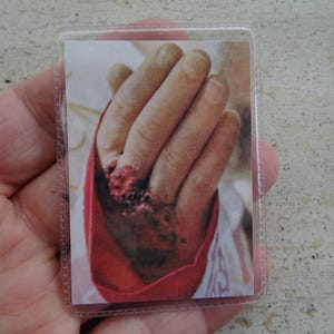 Religious catholic card shrine with photo of Padre Father Pio and his Stimata with inside a piece of cloth touched to his cuffin.  PP 3