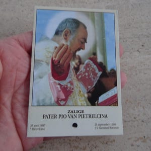Religious catholic card shrine with photo of Padre Father Pio and his Stimata with inside relic of a piece of cloth.  SS 10