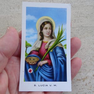 Religious card shrine with relic of Saint Lucia. ( O 38 )