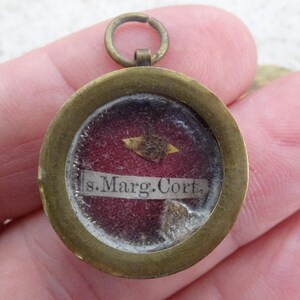 Religious antique French copper catholic medal shrine relic reliquary with relic of Saint Margaret of Corona. ( H 21 )