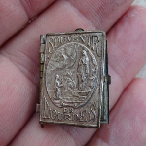 Antique religious French silvered booklet locket relic shrine of Holy Mary Notre Dame ( our Lady ) of Lourdes. ( 3 )