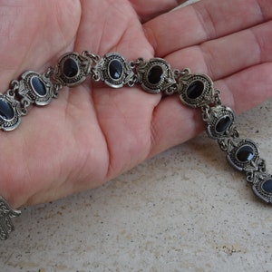 Antique French silver plated  bracelet with black stones and a medal pendant of a hand. ( B 14 )